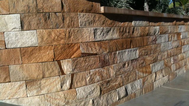 Natural sandstone retaining wall used in Queensland landscaping