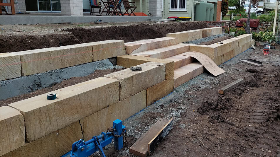 Preparing the foundation for a sandstone retaining wall