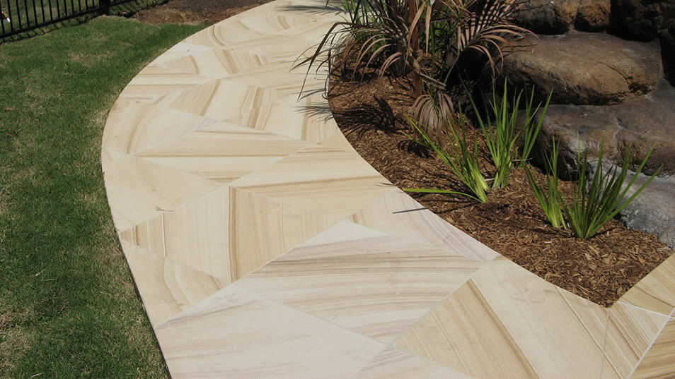 Sandstone Garden Path Natural sandstone pathway with warm textured stone.