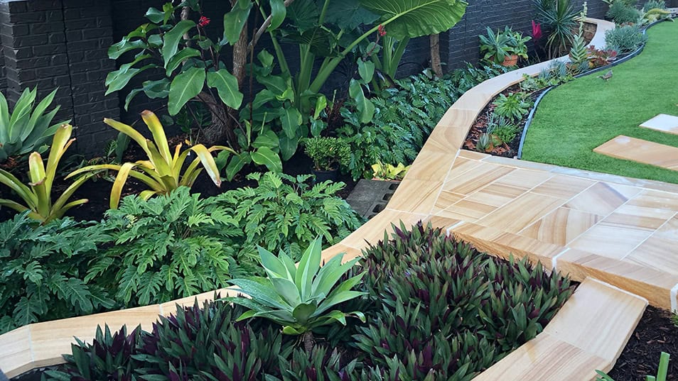 Natural Sandstone Pathway Edging Split sandstone garden edging along walkway